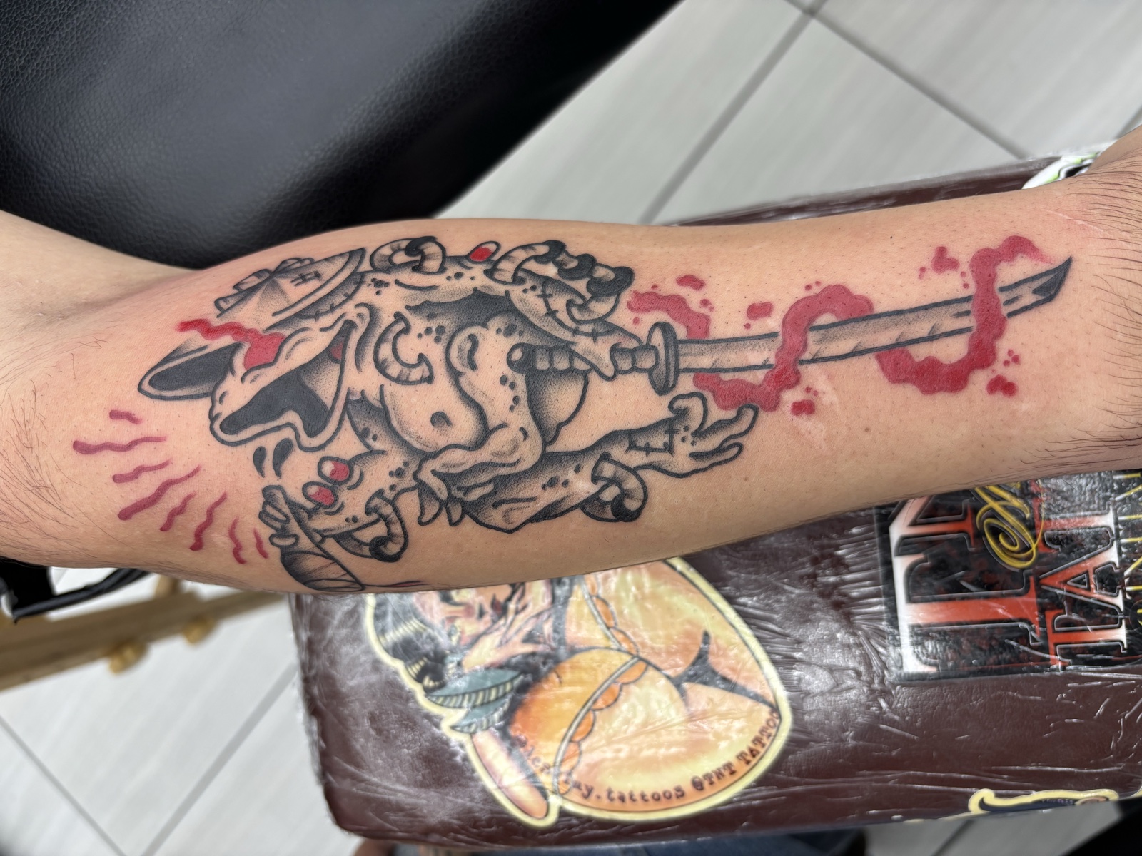 Bulldog with cleaver and blood splatters — punk-attitude neo-traditional with red color hits and bold linework